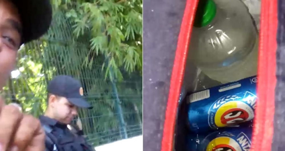 Policial militar em serviço exibe bebidas alcoólicas dentro de viatura